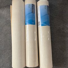3 rolls of cream wallpaper