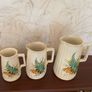 Charming vintage graduated set of three ceramic jugs Image 3