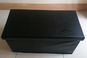 Black faux-leather folding storage ottoman