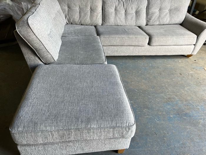 Grey corner sofa with matching footstool