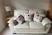 Cream leather two seater sofa