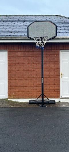 Portable Basketball Stand- Adjustable. stored in garage when not in use. In Very Good Condition.