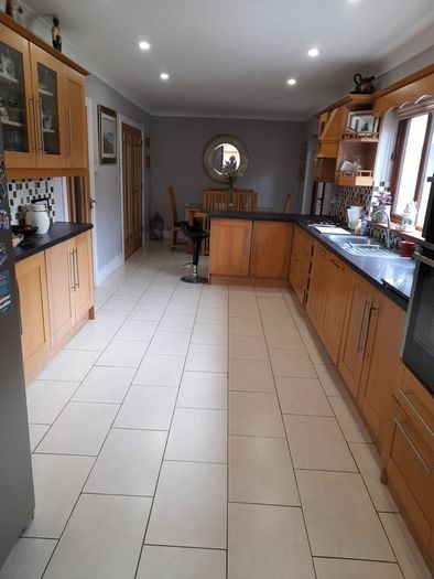 Solid oak kitchen shaker style American style samsung fridge freezer and electric hob.
