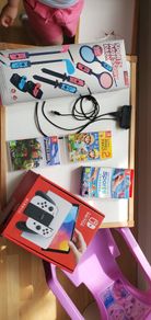 nintentendo switch with lots of games and sports pack accessories