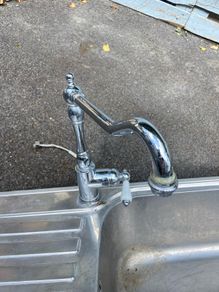 Kitchen sink with tap