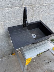 Composite kitchen sink with tap