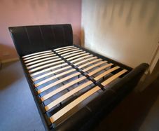 Faux leather king sleigh bed