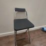 Foldable high stool used as a ladder Image 2