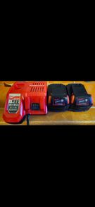 2 x Milwaukee M18 5Ah Batteries with Milwaukee M12-18 FC 12/18V Fast Charger.