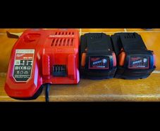 2 x Milwaukee M18 5Ah Batteries with Milwaukee M12-18 FC 12/18V Fast Charger.