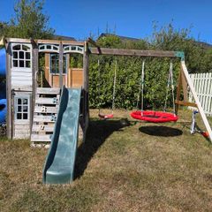 Garden Playhouse with 2 slides and 2 swings and monkey bar