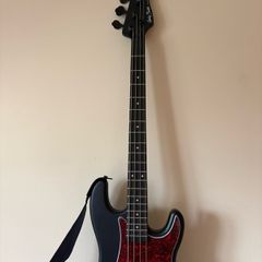 bass guitar and amplifier Harley Benton