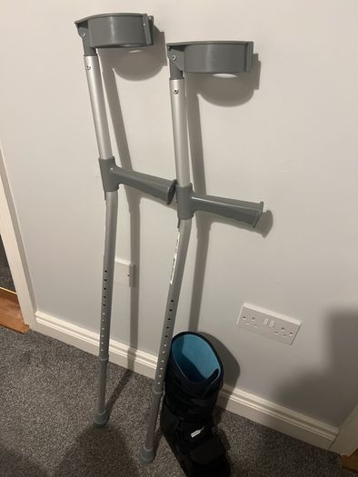 Pair of crutches and orthopedic boot