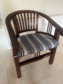 Traditional dark wooden chair with blue/grey cushion for office or study