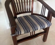 Traditional dark wooden chair with blue/grey cushion for office or study