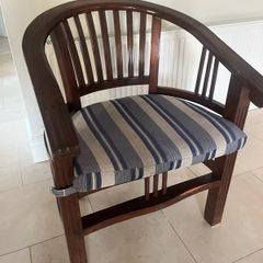 Traditional dark wooden chair with blue/grey cushion for office or study
