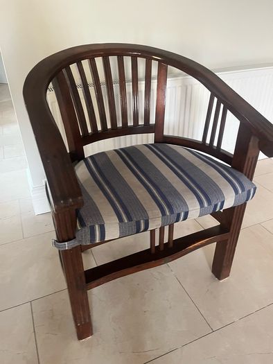 Traditional dark wooden chair with blue/grey cushion for office or study
