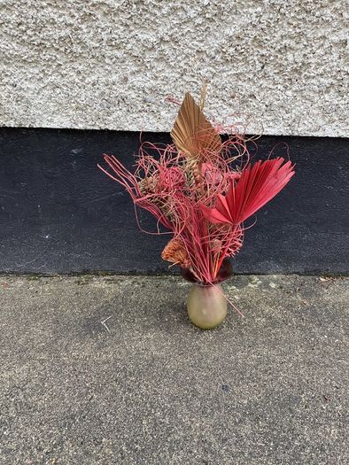 Dried flower arrangement in glass vase