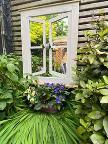 Garden mirror reflection window