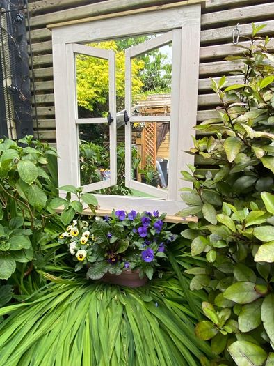Garden mirror reflection window