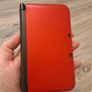 Red Nintendo 3DS xl and Aqua Blue Nintendo 3DS Image 9
