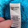 The North Face turquoise winter hat Image 4