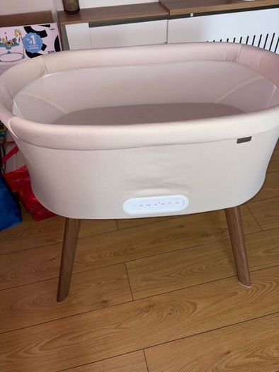 Nested motion electric bedside crib