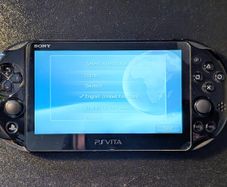 PS Vita Slim (Includes Carrying Case and 3 Games)