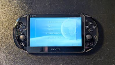 PS Vita Slim (Includes Carrying Case and 3 Games)