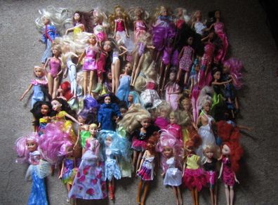 Barbie and barbie type dolls all dressed, 54 of them