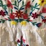 White dress with colourful embroidery Image 2