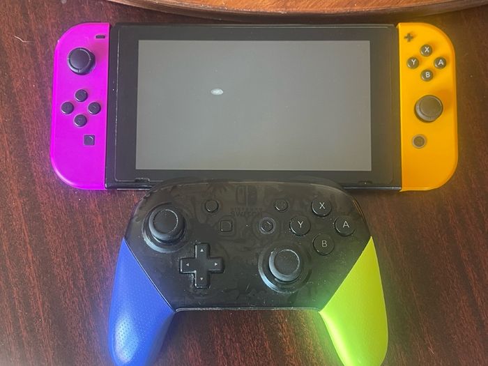 Nintendo Switch console with Splatoon 3 Pro Controller