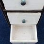 Small vintage wooden storage unit with heavy ceramic drawers with brass knobs Image 5
