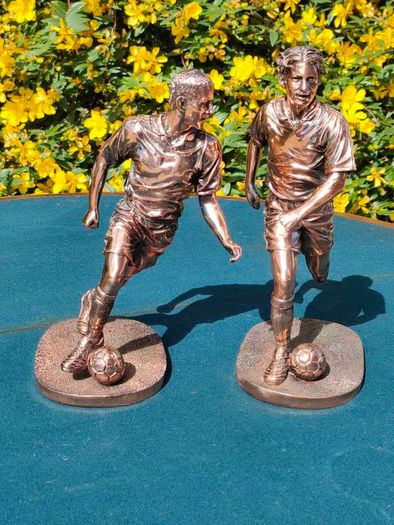 Two Gilded footballers