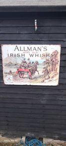 large  allmans  whiskey  metal  sign