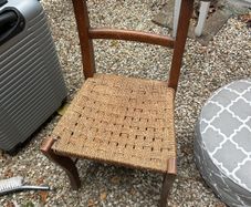 Solid wood chair with woven seat