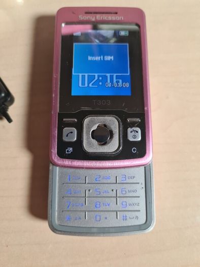 Sony Ericsson T303 pink mobile phone and speakers MPS-60