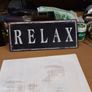 Sign "relax" Image 4