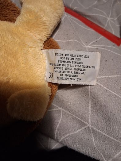 Turtle soft toy with large green eyes