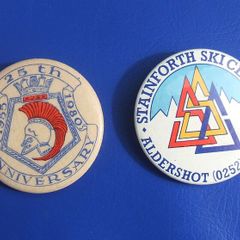 BUTTON BADGES x 2 (1 1/2" diameter) - HMS AJAX 25th anniversary 1955-1980 and Stainforth Ski Centre, Aldershot
