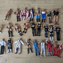 24 WWE Figures & 1 Pop! Cody Rhodes