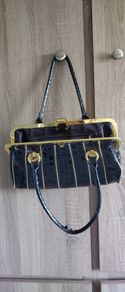 Black lacquered gold bag