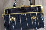 Black lacquered gold bag