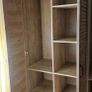 JYSK MANDERUP 3-door wardrobe in a wild oak finish, featuring slatted-style louvered doors. Image 2