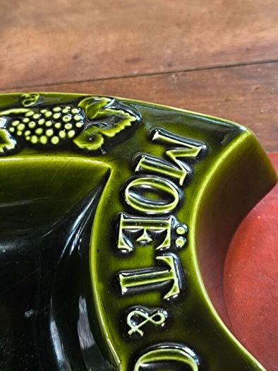 vintage Moet & Chandon shield-shaped ceramic advertising piece.