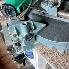 Hitachi sliding mitre chop saw together with a tra
