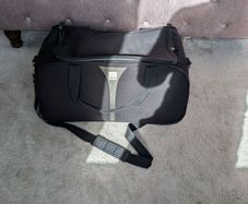 Tripp Black Wheeled Travel Duffle Bag / Holdall (55 x 33 x 30 cm)