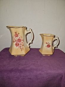 Antique pair of Rockingham Staffordshire floral jugs