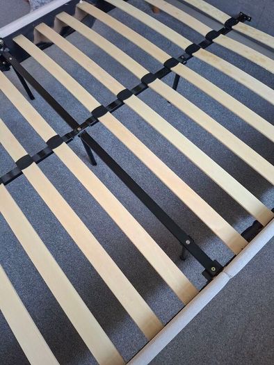 Standard double bed with cream headboard