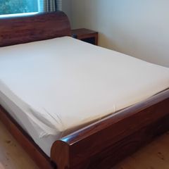 Solid wood king size bed.